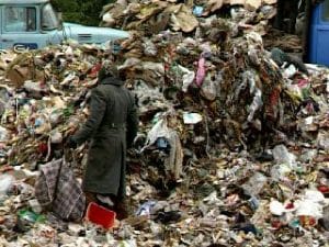 Dumpster diving, Poor men and children scavenge the trash dumps in Russia