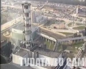 Helicopter flying over wrecked burning carcass reactor exploded nuclear Chernobyl power plant stock video footage